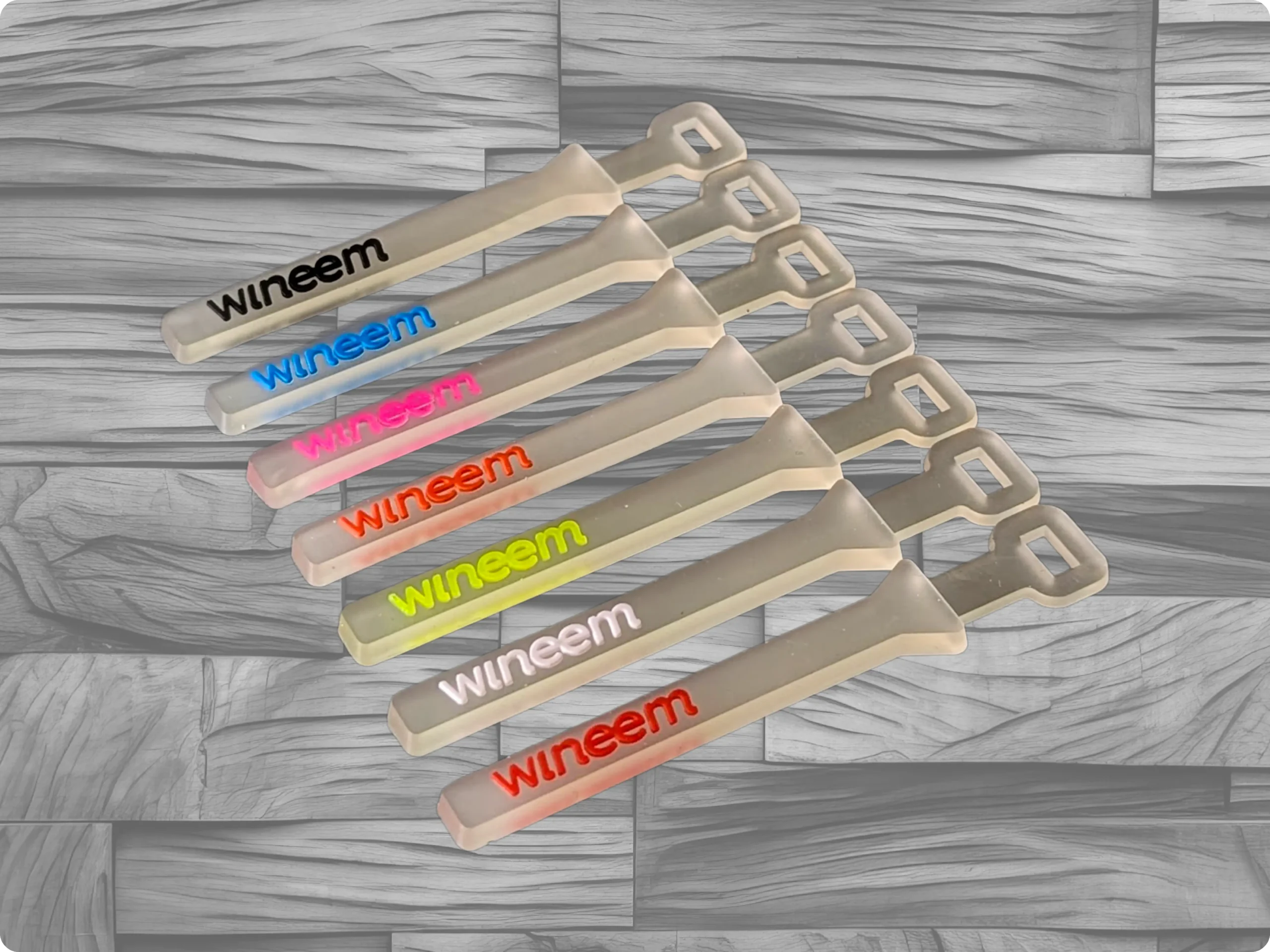 Tiracierres de plastisol con base transparente y letras fluor